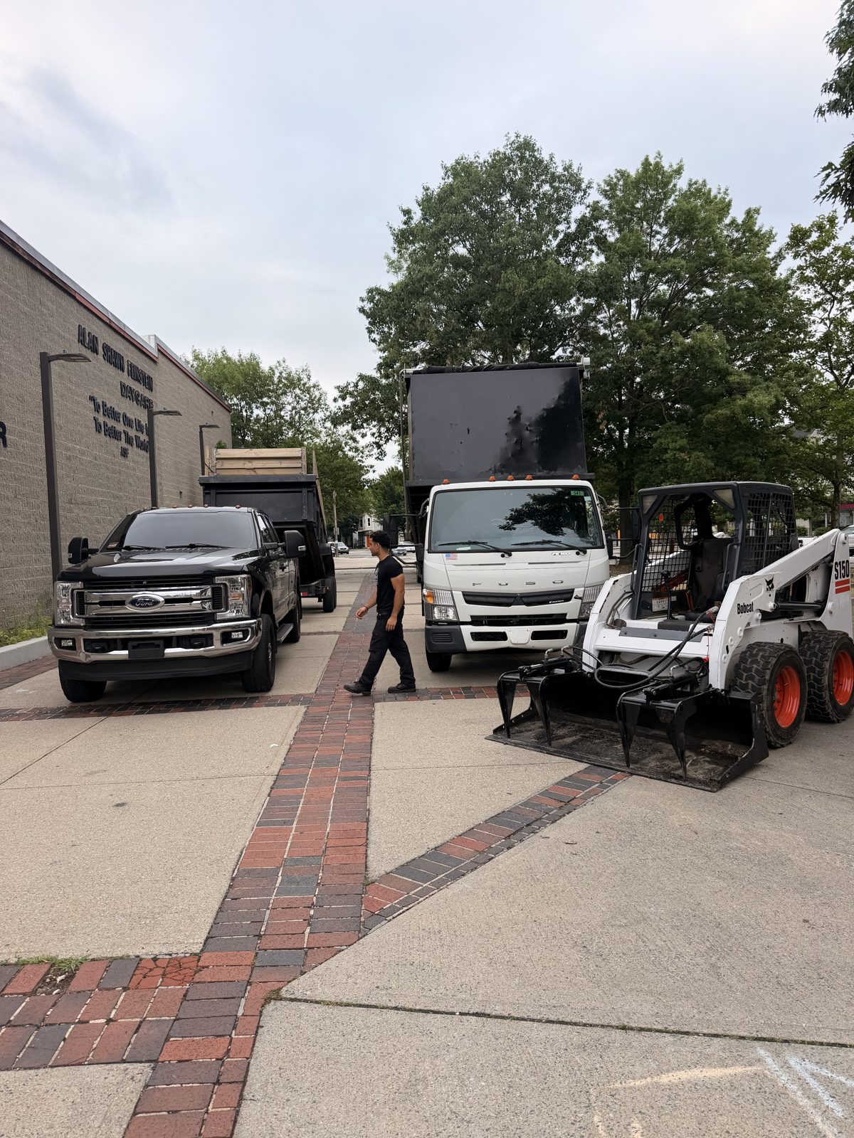 The company dump truck and skid steer staged and ready for a job
